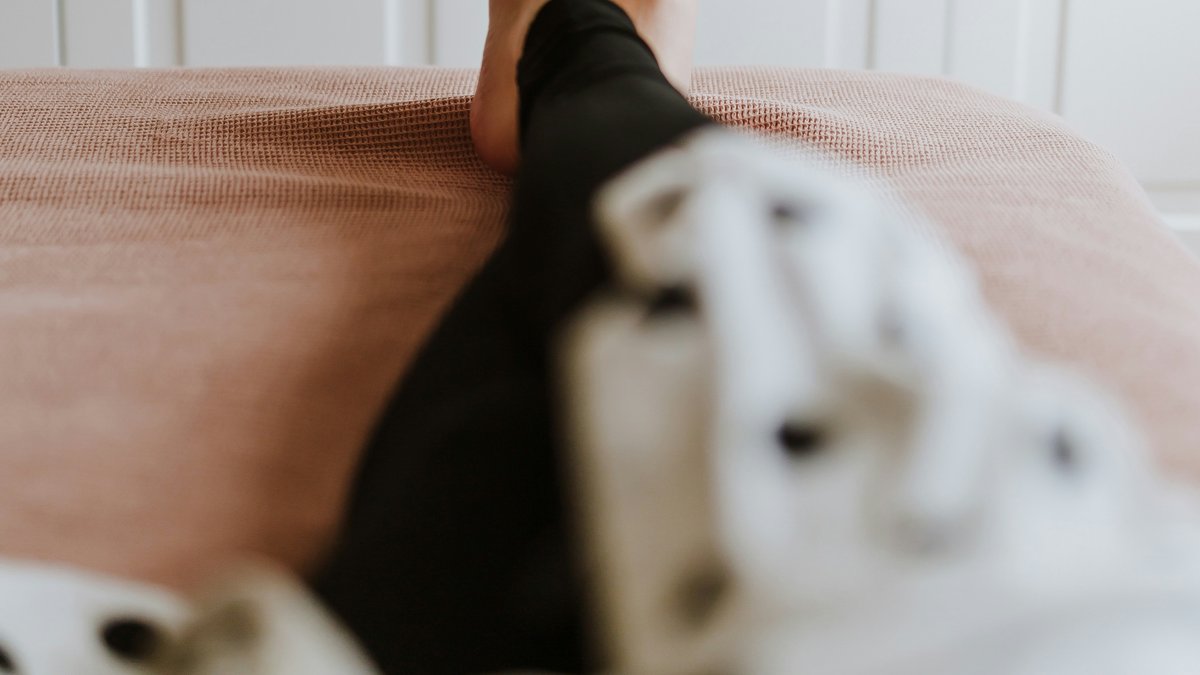 A bare foot at rest in soft natural light.