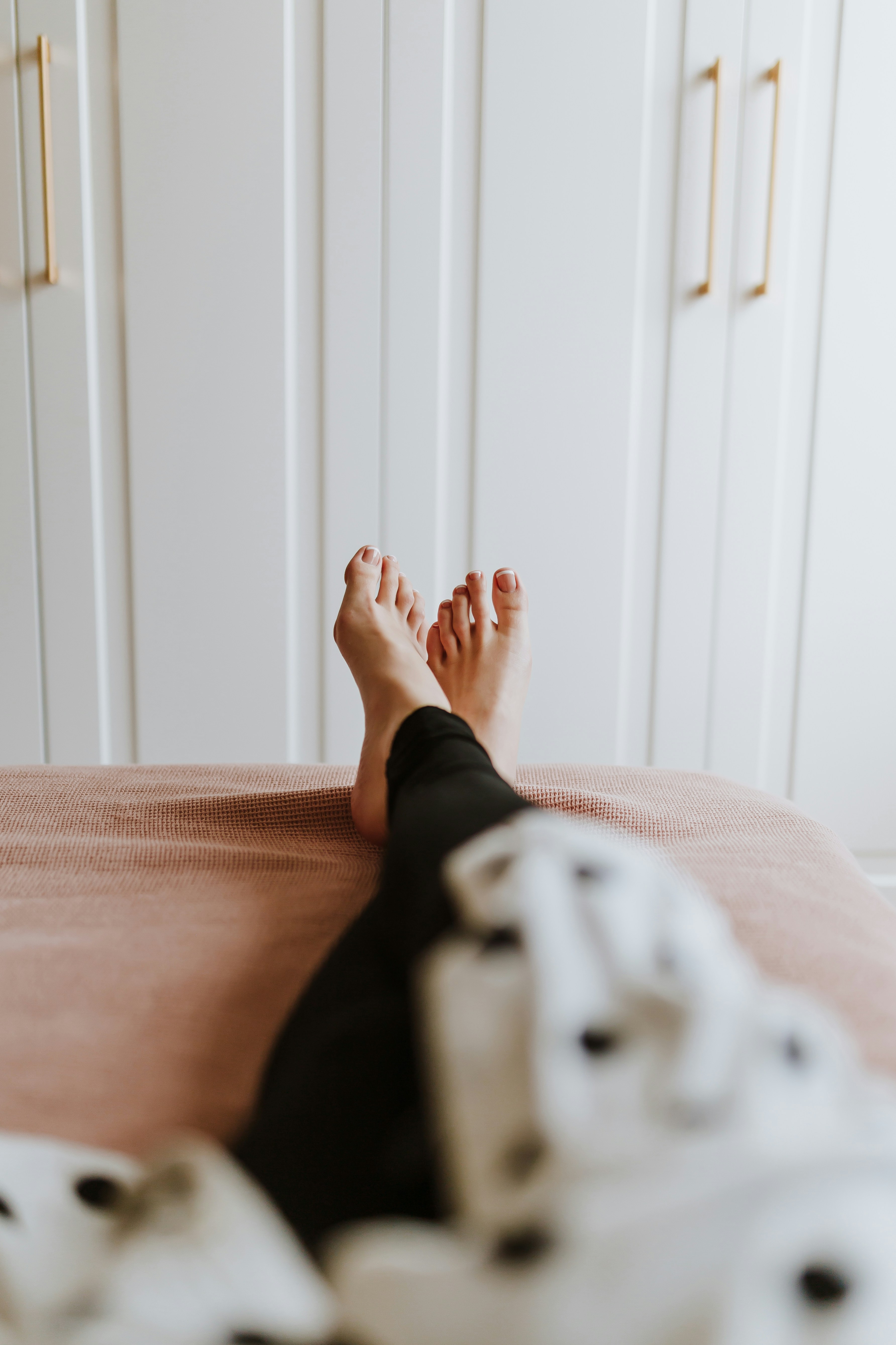 A bare foot at rest in soft natural light.
